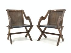 Pair of Victorian oak Glastonbury chairs, with pierced Gothic detail, panelled backs and seats,