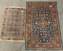 Persian design red ground rug, floral medallion surrounded by trailing foliate on blue field,