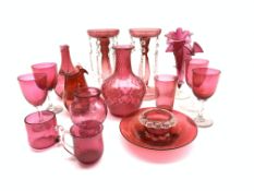 Pair of cranberry glass mantle glasses hung with spear glass lustre drops, H20cm,