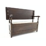 Early 20th century oak monks bench with hinged storage compartment, panelled front and sides,