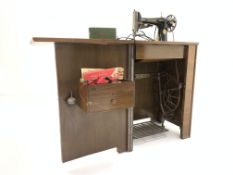 Early 20th century walnut singer sewing machine cabinet, W57cm, H76c,