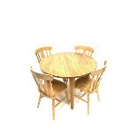 Contemporary solid oak circular dining table raised on square tapered supports (110cm x 110cm,