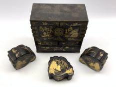 Japanese black lacquered and gilt miniature table cabinet fitted with small drawers W23cm and three