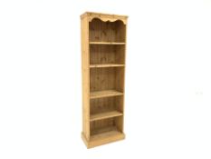 20th century pine open bookcase with two fixed and two adjustable shelves, plinth base, W60cm,