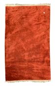 Chinese woollen red carpet, central medallion on red field, scrolled floral spandrels,