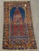 Caucasian design prayer rug, red mihrab on blue field, geometric pattern to border,