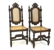 Pair Charles II style oak hall chairs, cresting rail carved with lion mask,