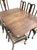 Georgian mahogany drop leaf dining table, the top with rounded corners,