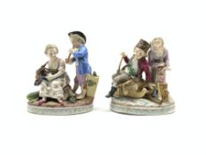 Pair of Thuringian porcelain figure groups depicting Summer and Winter on oval bases approx 15cm x