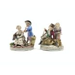 Pair of Thuringian porcelain figure groups depicting Summer and Winter on oval bases approx 15cm x