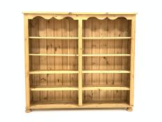 20th century pine open bookcase, rectangular moulded top above shaped apron,