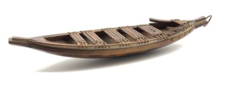 Wooden model of a tribal canoe with ornamental prow L66cm possibly South Sea Islands