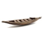 Wooden model of a tribal canoe with ornamental prow L66cm possibly South Sea Islands