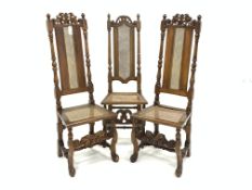 Pair of Charles II beech framed hall chairs, carved cresting rail, cane panel seat and back,