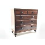 Miniature Victorian mahogany chest of four long graduated drawers,