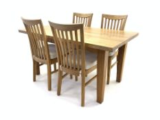 Modern solid light oak dining table, raised on square tapered supports (150cm x 86cm,