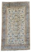 Large Persian Kashan beige carpet, ivory field decorated with trailing foliate,