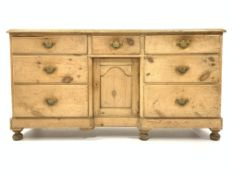 Victorian pine sideboard, with one short and six long graduating drawers,