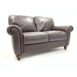 'Italsofa' two seat sofa, upholstered in brown leather, turned stained beech feet,