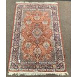 Persian Kashan design ground rug, flora medallion on red field,