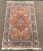 Persian Kashan design ground rug, flora medallion on red field,