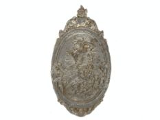 Oval lead plaque decorated in relief with cherubs beneath an urn finial, H69cm,