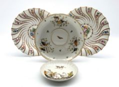 Pair of Meissen plates painted with a centre panel of flowers within a moulded and painted surround