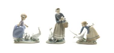 Three Lladro figures, shepherdess with ducks '4568', H24cm,