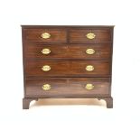 George III mahogany chest of two short and three long graduating drawers, shaped bracket feet,