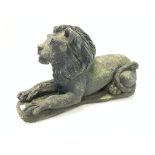 Composite stone recumbent lion garden ornament,