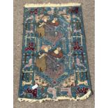 Caucasian design blue ground rug, decorated with figures, animals and geometric patterns,