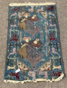 Caucasian design blue ground rug, decorated with figures, animals and geometric patterns,