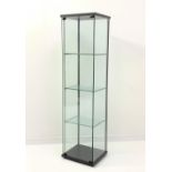 Glass display cabinet, with three shelves, on ebonised base, W43cm, H164cm,