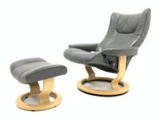 Ekornes Stressless reclining armchair and matching footstool upholstered in grey leather,