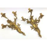 Pair Rococo style gilt metal three branch wall sconces,