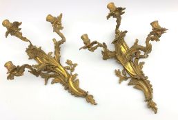 Pair Rococo style gilt metal three branch wall sconces,