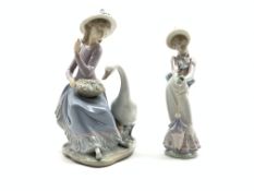 Two Lladro figures, goose trying to eat '5034',