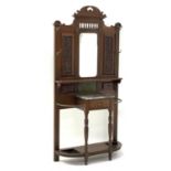 Late Victorian mirrored back hall stand, with fluted detail, bevelled mirror, six brass hooks,