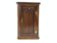 19th century oak wall hanging corner cupboard, dentil cornice over fielded panelled door,