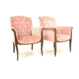 Pair late 19th century mahogany framed easy chairs, upholstered in pink velvet, panel arms,