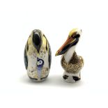 Royal Crown Derby 'Brown Pelican' and 'Penguin and Chick' paperweights,