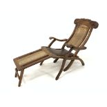 Early 20th century teak folding steamer chair, leaf scroll carved cresting rail,