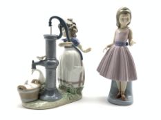 Lladro figure of a young girl working a water pump,