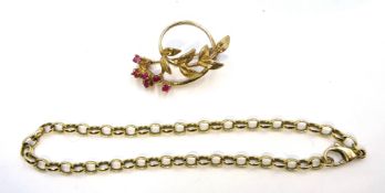 9ct gold ruby leaf design brooch hallmarked and a 9ct gold cable link chain bracelet stamped 375