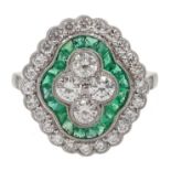 Platinum (tested) round brilliant cut diamond and calibre cut emerald ring,