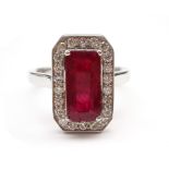 18ct white gold emerald cut ruby and round brilliant cut diamond cluster ring, hallmarked,