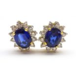 Pair of 18ct gold sapphire and diamond cluster stud earring stamped 750, sapphire total weight 2.