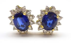 Pair of 18ct gold sapphire and diamond cluster stud earring stamped 750, sapphire total weight 2.