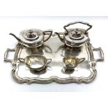 Silver four piece tea set of panel sided design comprising teapot, kettle,