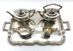 Silver four piece tea set of panel sided design comprising teapot, kettle,